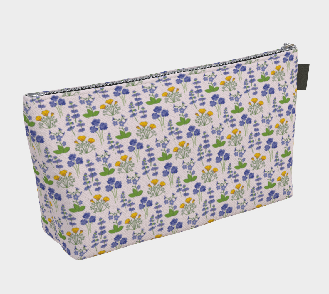 Large Carry All Make Up Bag with denim lining. Light wildflower floral pattern. Back view.