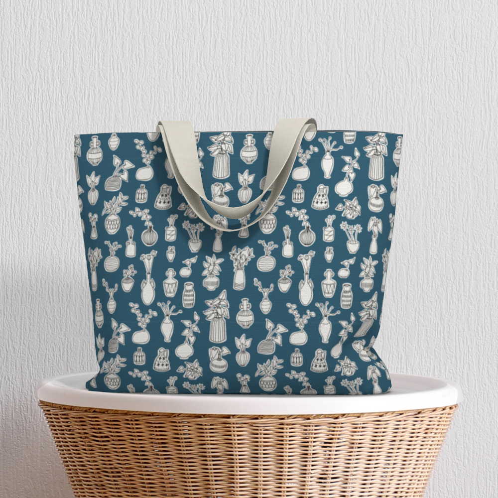 Oversized Fully Lined Cotton Tote Bag with sturdy 1 ½ inch strap. Whimsical blue pattern featuring doodles of house plants. Shown on wicker basket.