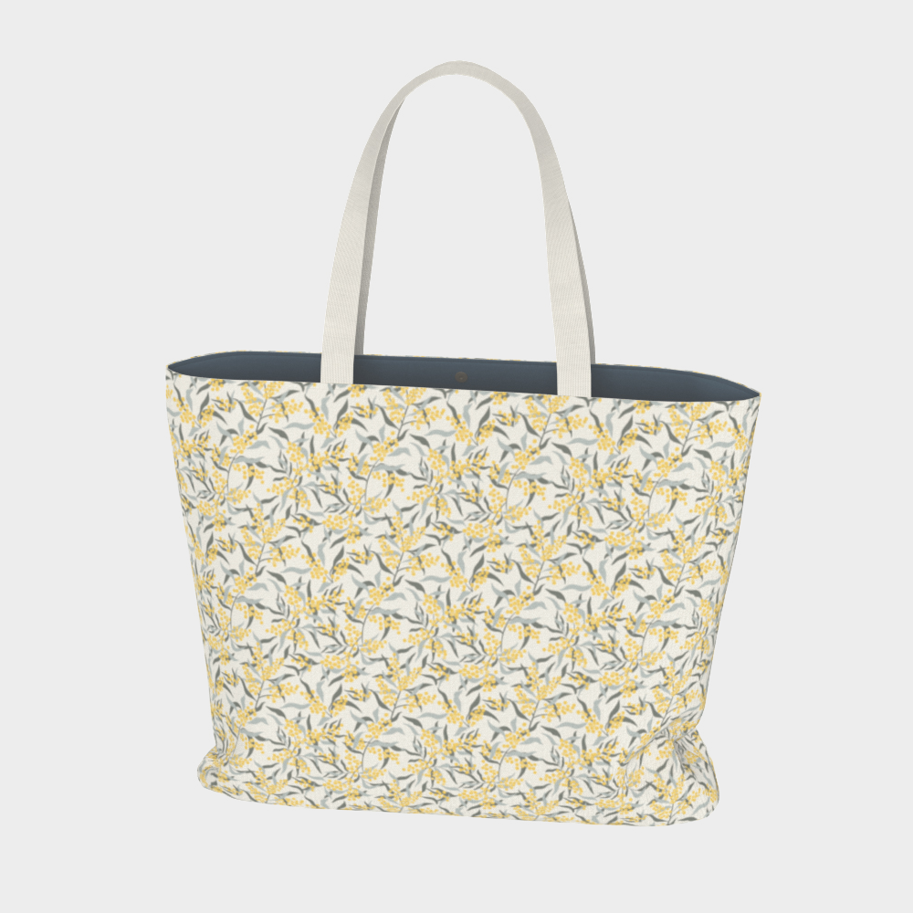 Oversized Fully Lined Cotton Tote Bag with sturdy 1 ½ inch strap. Floral botanical pattern featuring sage green leaves and yellow blossoms on a creamy white background. Front view.