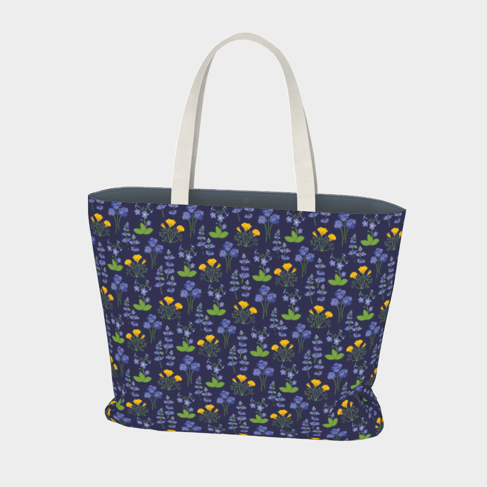 Oversized Fully Lined Cotton Tote Bag with sturdy 1 ½ inch strap. Wildflower pattern featuring California poppies and wild lupine on dark blue background. Front View.