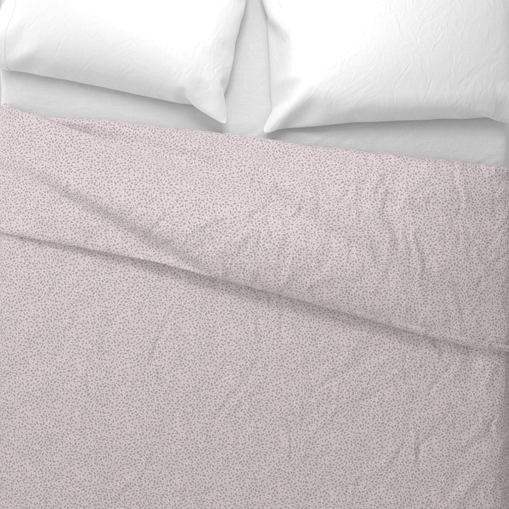 Duvet Cover with Sandy Pebbles pattern in blush pink - top down view