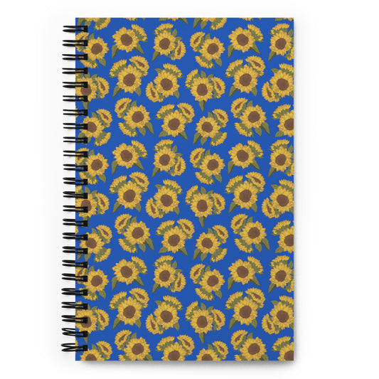 Bullet journal spiral notebook with ditsy sunflower pattern on royal blue. Front cover. 