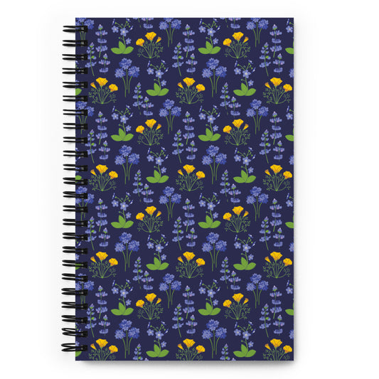 Bullet journal spiral notebook with wildflower pattern on a dark background. Front cover. 